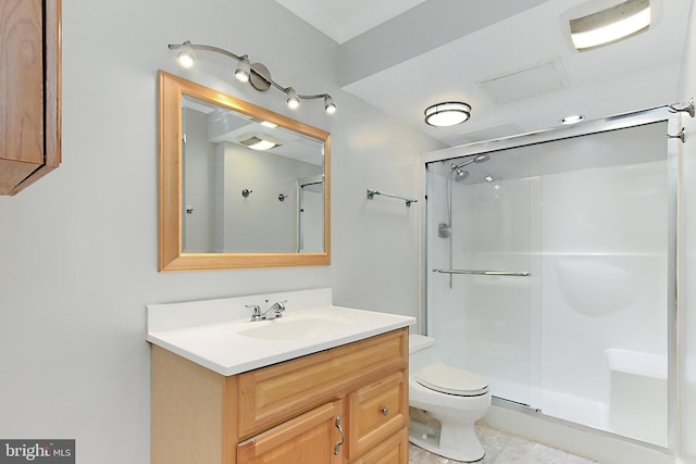 bathroom with tile patterned flooring, an enclosed shower, vanity, and toilet