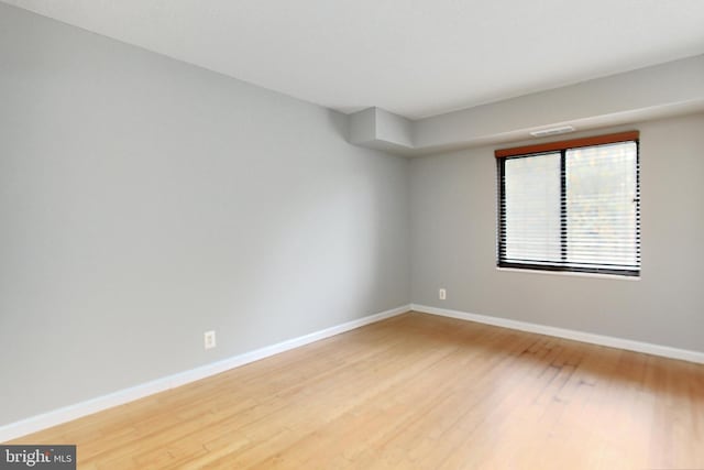 empty room with hardwood / wood-style floors