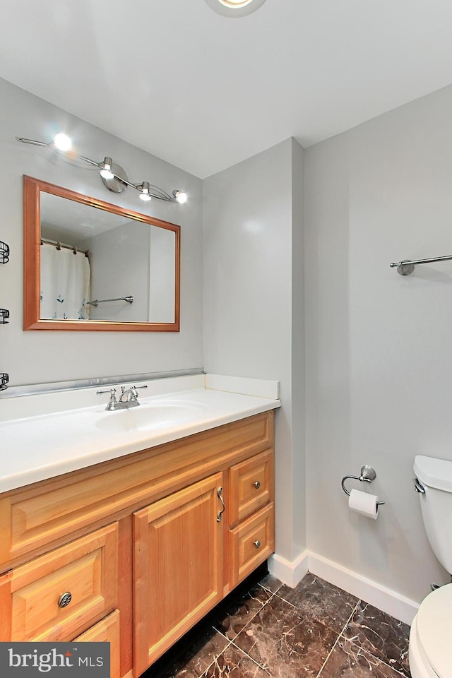 bathroom with vanity and toilet