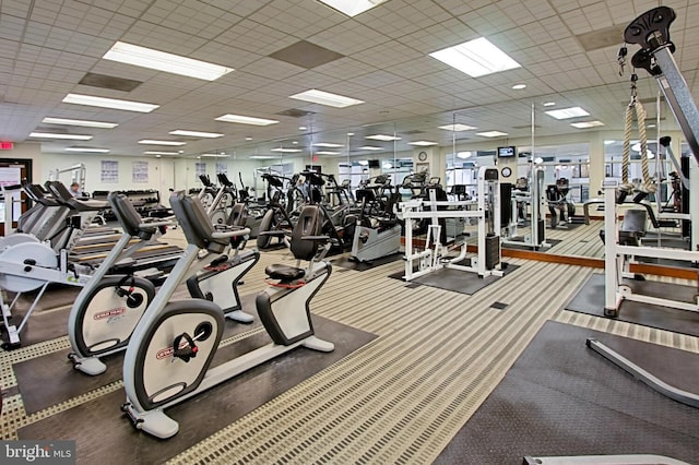 exercise room with a paneled ceiling