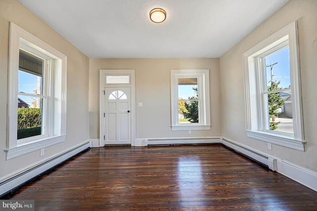 foyer entrance with plenty of natural light, wood finished floors, and a baseboard heating unit