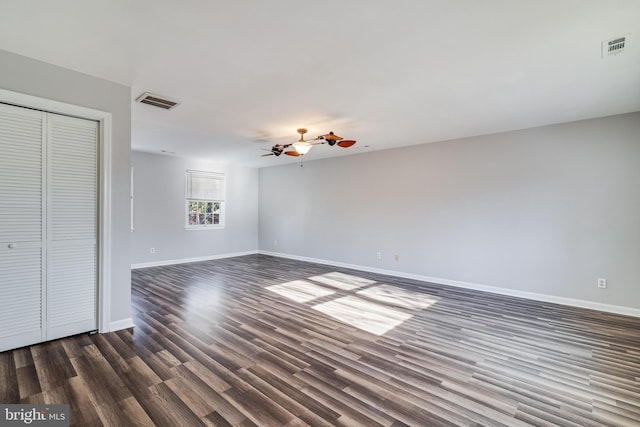 interior space with dark hardwood / wood-style flooring and a closet