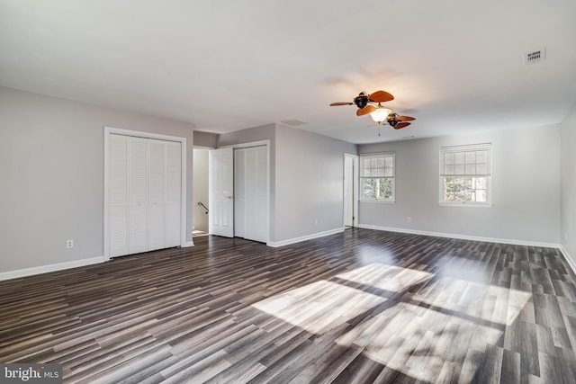 interior space featuring dark hardwood / wood-style floors and ceiling fan