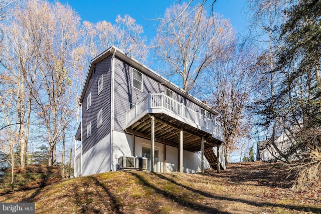 rear view of house featuring a deck