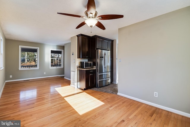 kitchen with ceiling fan, light hardwood / wood-style flooring, and stainless steel appliances