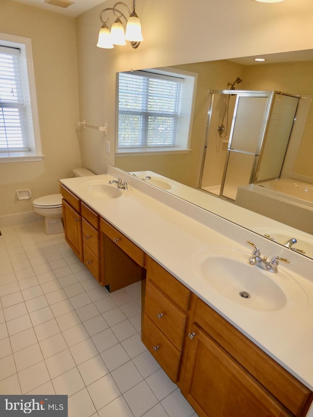 full bathroom with vanity, tile patterned flooring, toilet, and plus walk in shower