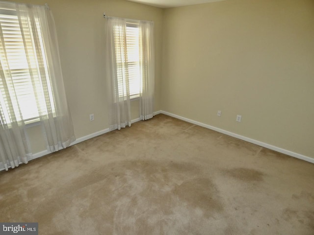 empty room with light colored carpet