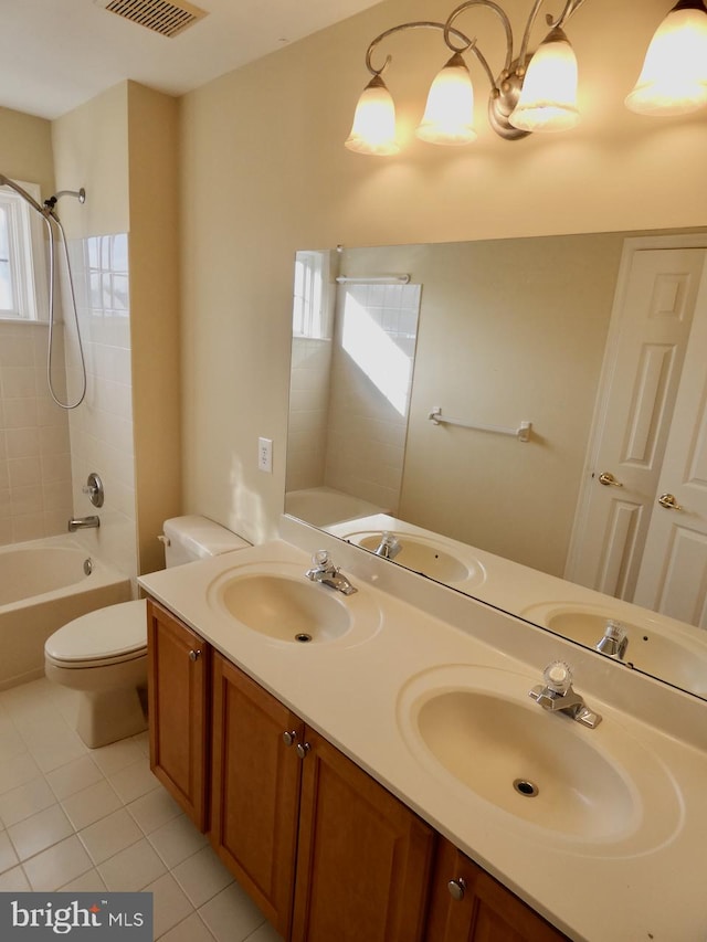 full bathroom featuring a wealth of natural light, tile patterned flooring, toilet, and tiled shower / bath