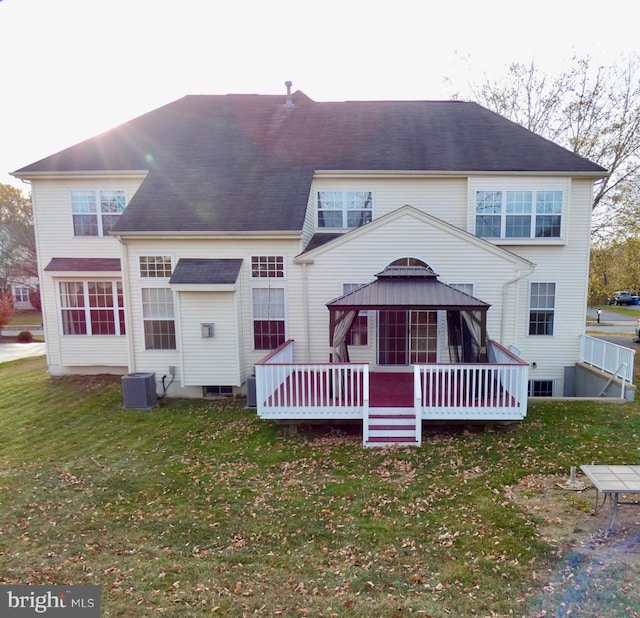 back of property with a gazebo, central AC, a yard, and a deck