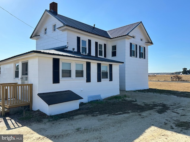 rear view of house with a wooden deck