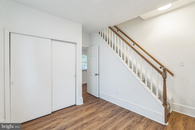 stairway with wood-type flooring