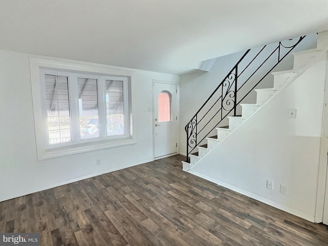 entrance foyer with dark hardwood / wood-style flooring