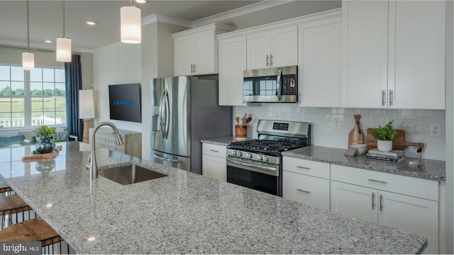 6819 Winterhill Ln, Glen Burnie, MD 21060 - kitchen with a sink, crown molding, a large island, white cabinets, and appliances with stainless steel finishes