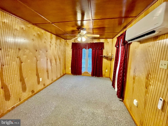 carpeted empty room with a wall mounted air conditioner and wooden walls