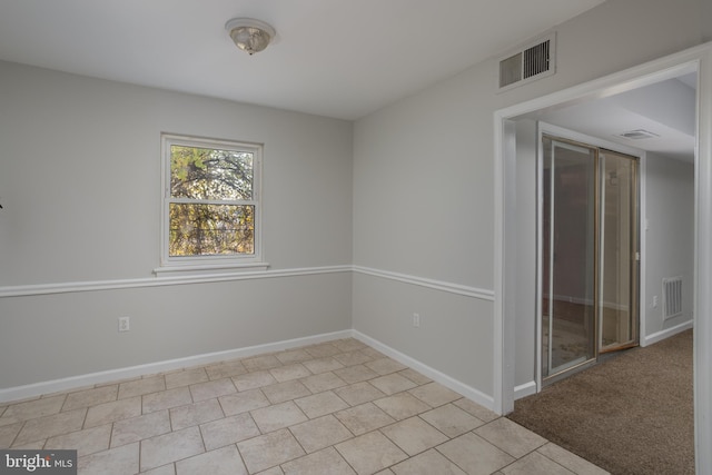 view of carpeted spare room