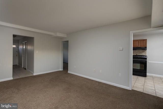 empty room featuring light carpet