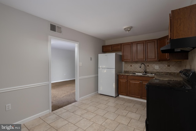 kitchen featuring extractor fan, black range with electric cooktop, sink, white fridge, and tasteful backsplash