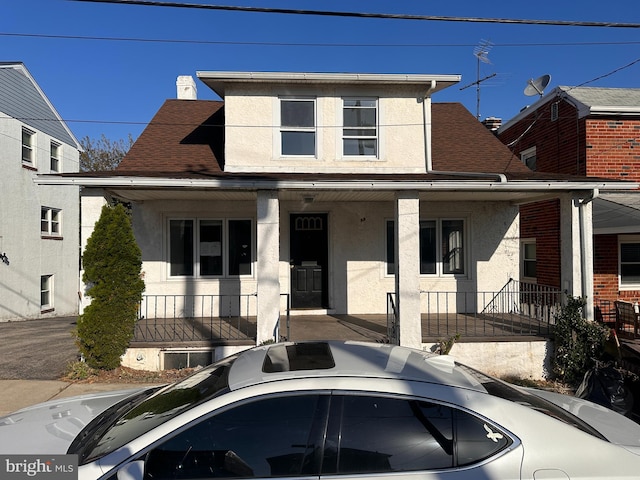 view of front of property featuring covered porch