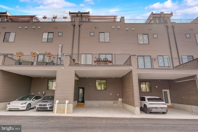 view of building exterior with a carport