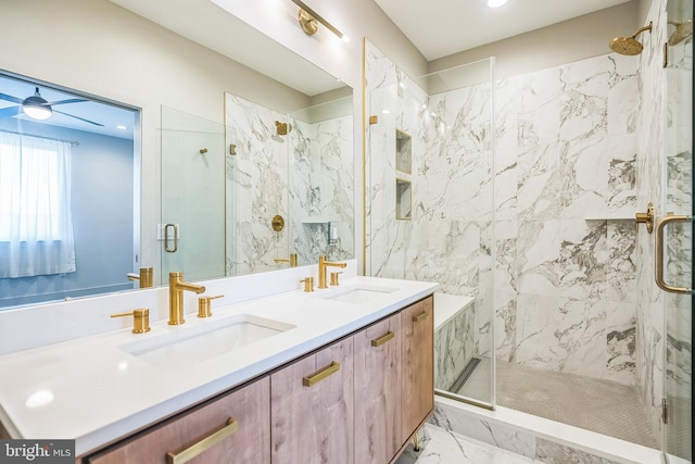 bathroom with vanity, ceiling fan, and a shower with shower door