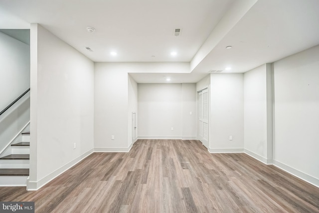 basement featuring light wood-type flooring