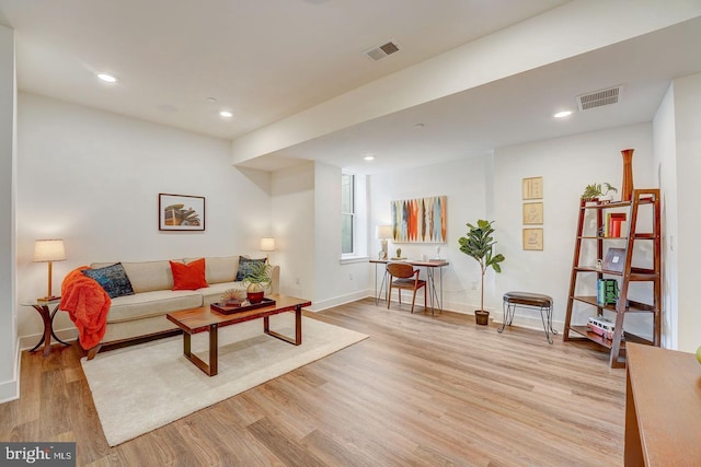 living room with light hardwood / wood-style floors