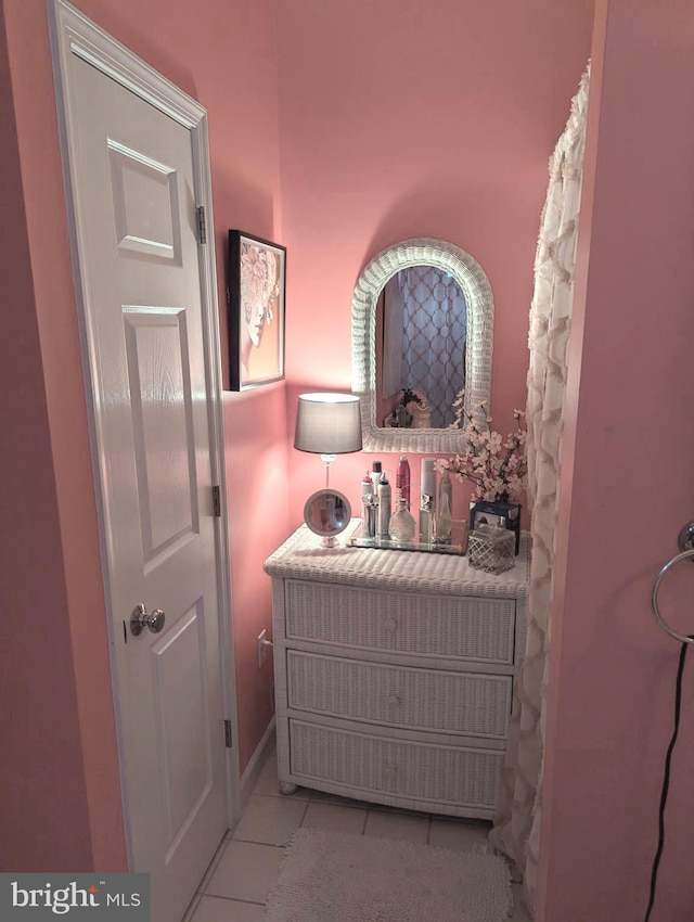 bathroom with tile patterned floors and vanity
