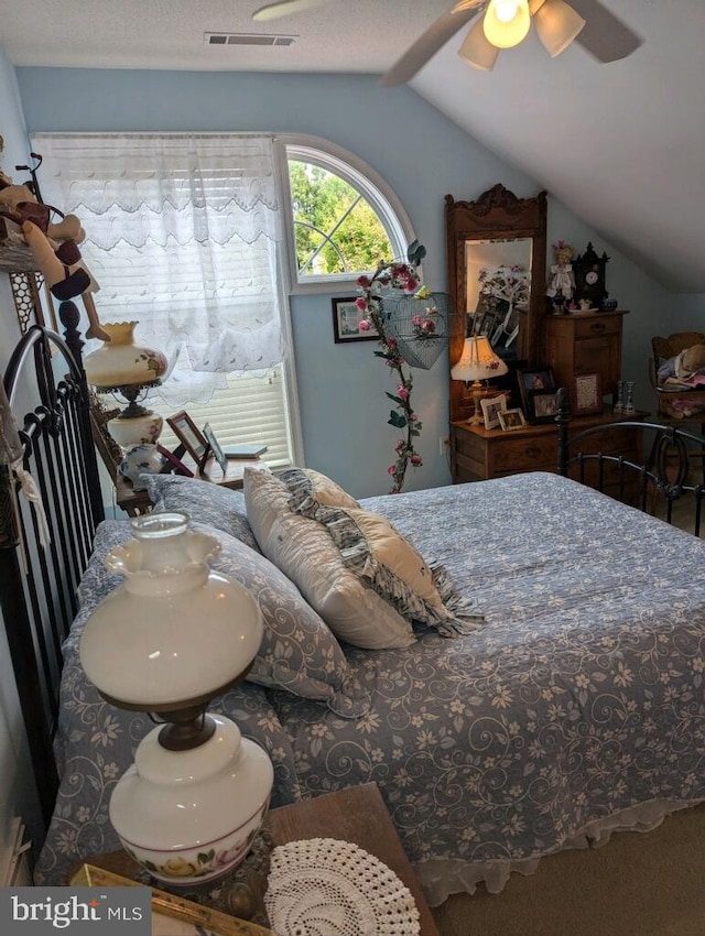 bedroom with ceiling fan and lofted ceiling