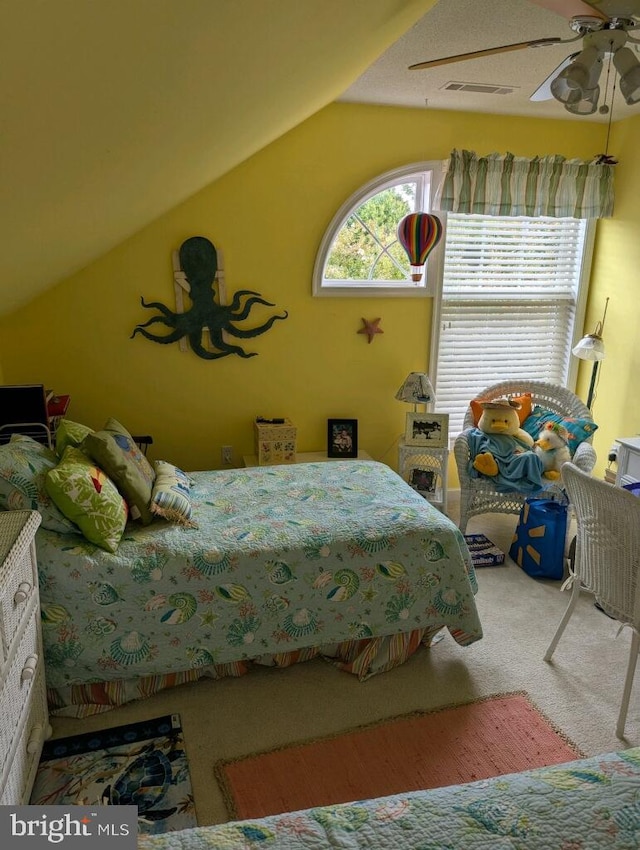 bedroom with ceiling fan, carpet, and lofted ceiling