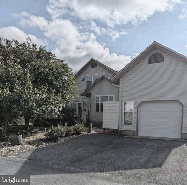 view of front of home featuring aphalt driveway
