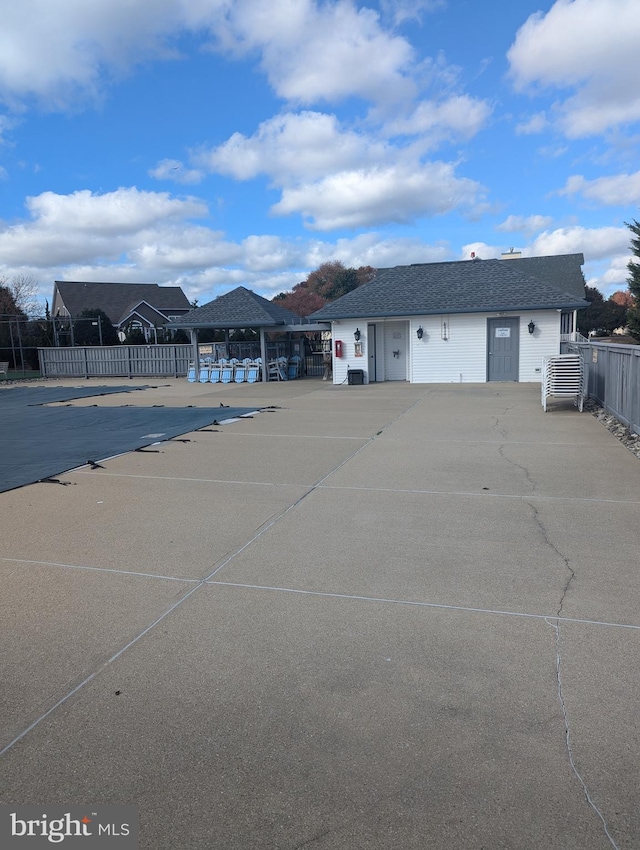 exterior space with a gazebo and fence