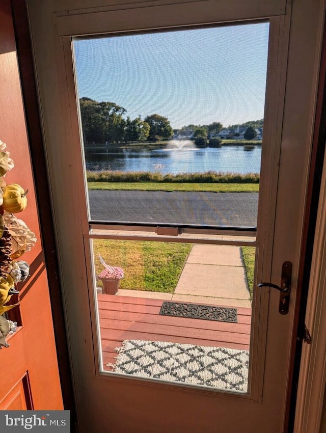 doorway featuring a water view