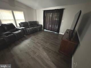 316 Thunderbird Dr, Lusby, MD 20657 - living area with baseboards, wood finished floors, and vaulted ceiling