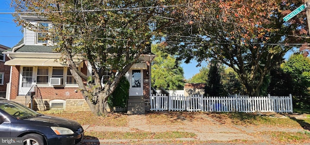 view of property hidden behind natural elements