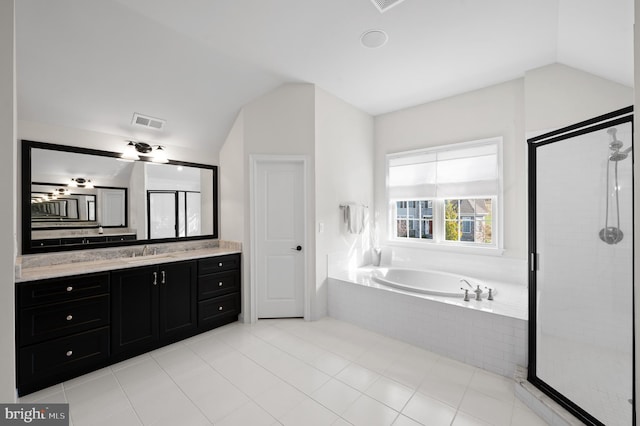 bathroom with vanity, tile patterned floors, separate shower and tub, and lofted ceiling