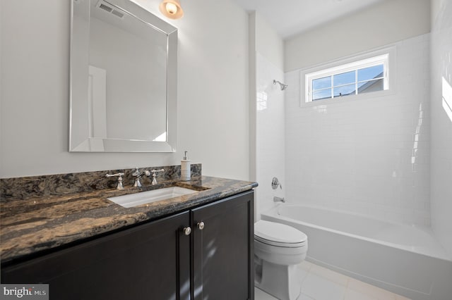 full bathroom with vanity, toilet, and tiled shower / bath combo