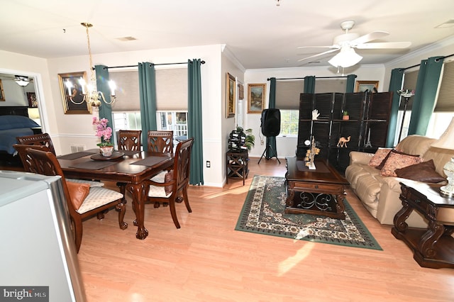 interior space with ornamental molding, light hardwood / wood-style flooring, and ceiling fan with notable chandelier