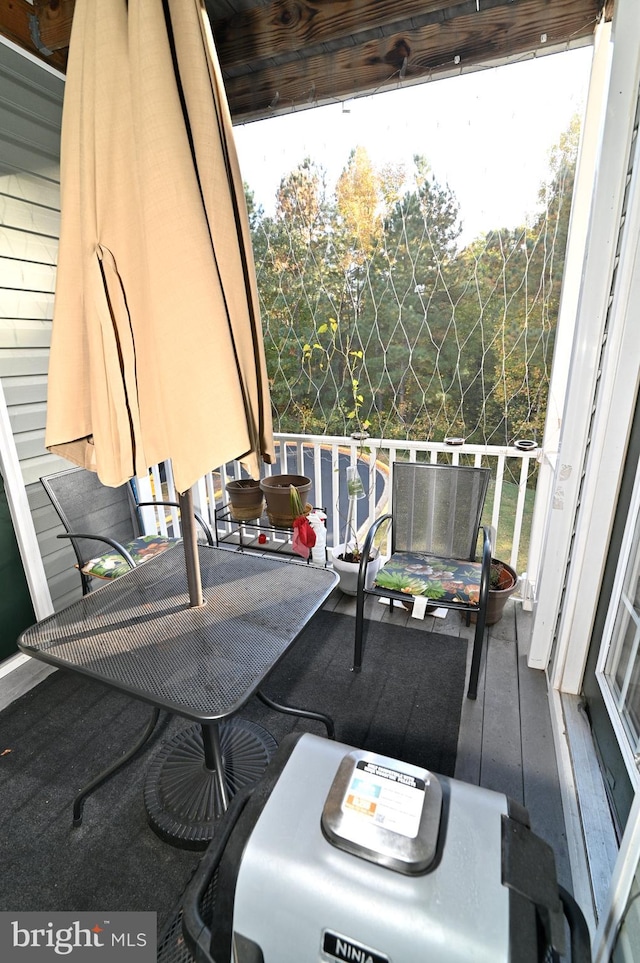 view of patio featuring a balcony