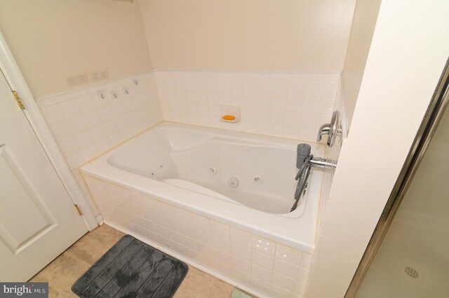 bathroom with separate shower and tub