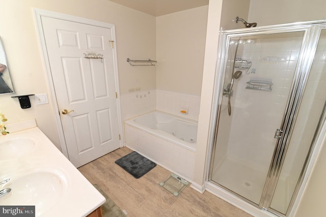 bathroom with vanity, hardwood / wood-style flooring, and separate shower and tub