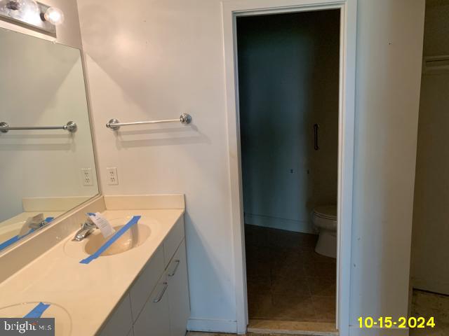 bathroom with vanity and toilet