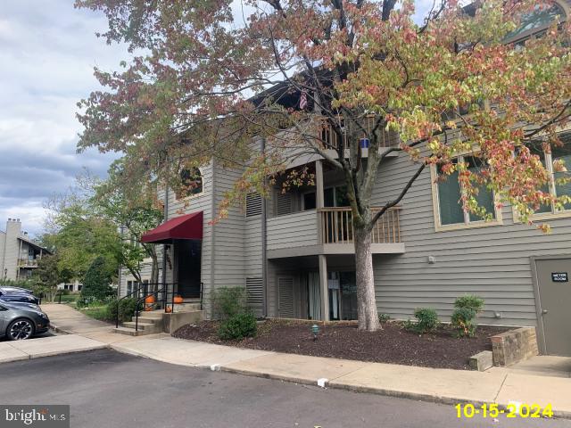 view of front of property with a balcony