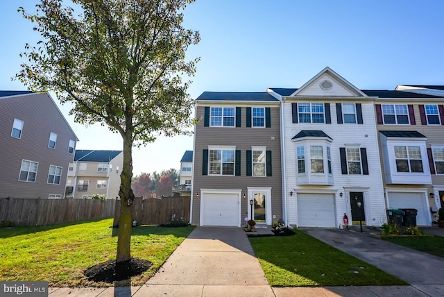 multi unit property with a front yard and a garage