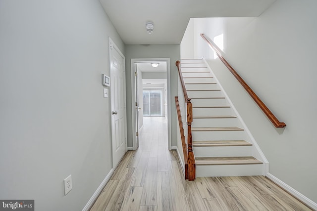 stairway with wood-type flooring