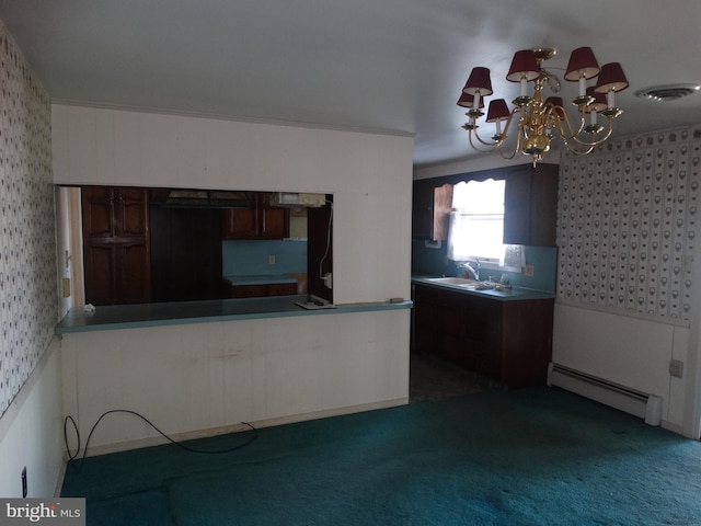 kitchen featuring dark colored carpet, a baseboard heating unit, dark brown cabinets, sink, and a chandelier