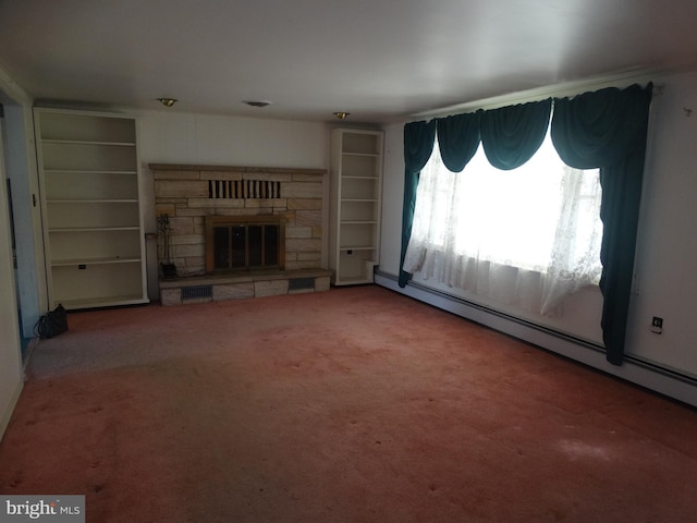 unfurnished living room with a stone fireplace, a baseboard heating unit, and carpet flooring