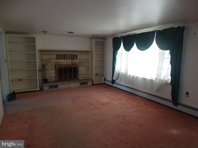 unfurnished living room with a stone fireplace, carpet floors, and baseboard heating