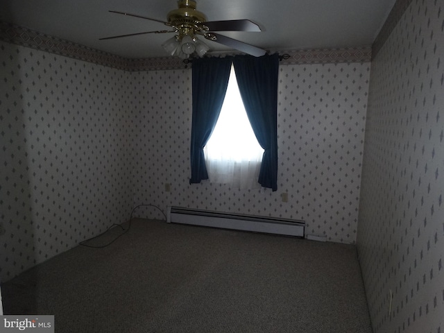 empty room featuring ceiling fan, carpet flooring, and baseboard heating