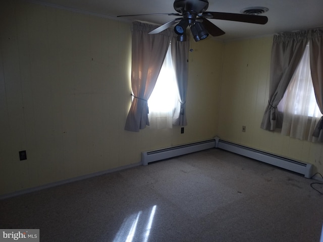 empty room featuring a baseboard radiator and ceiling fan