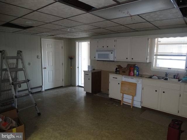 kitchen with white cabinetry, sink, a paneled ceiling, and white appliances